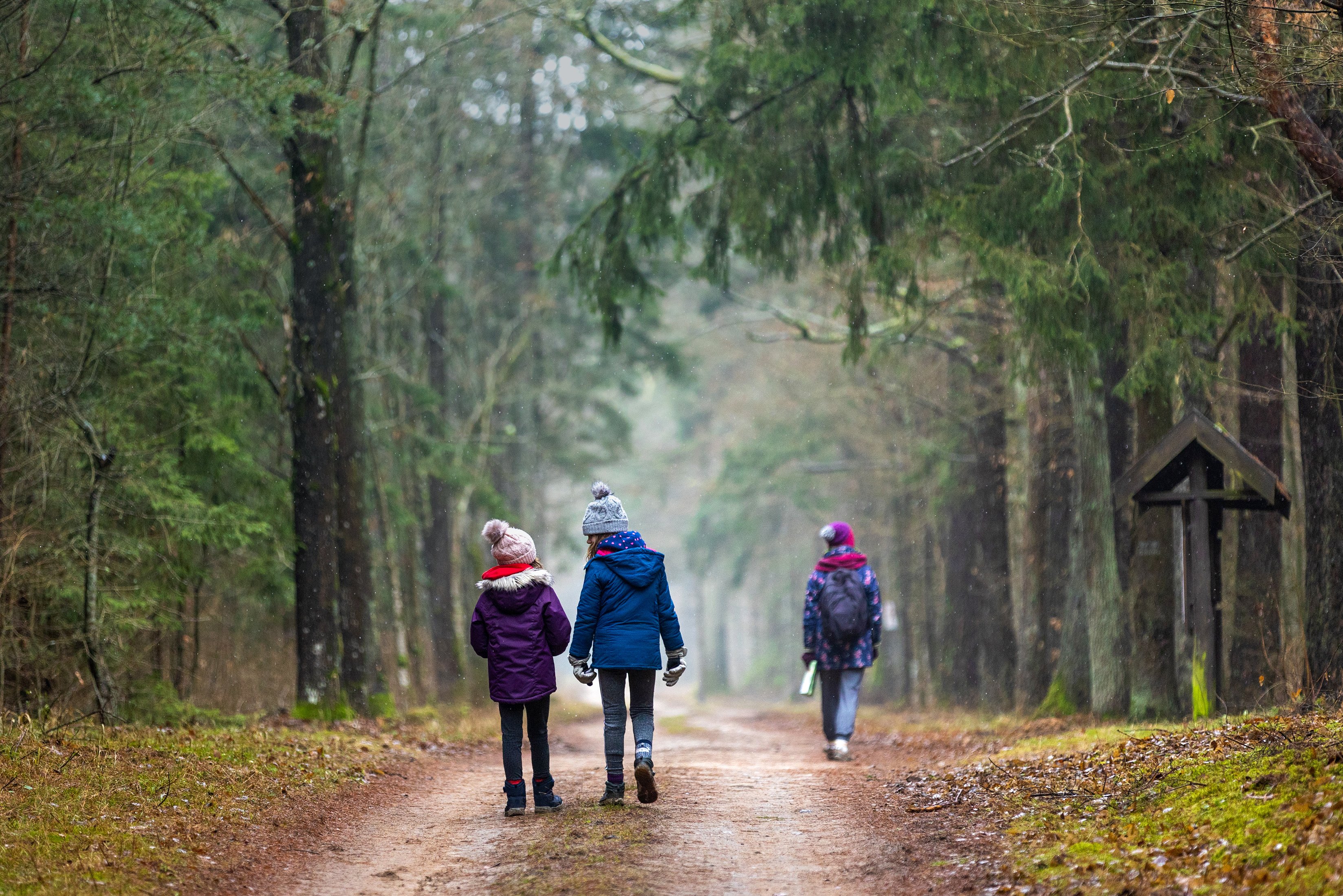 Kids dressed warmly while playing outside