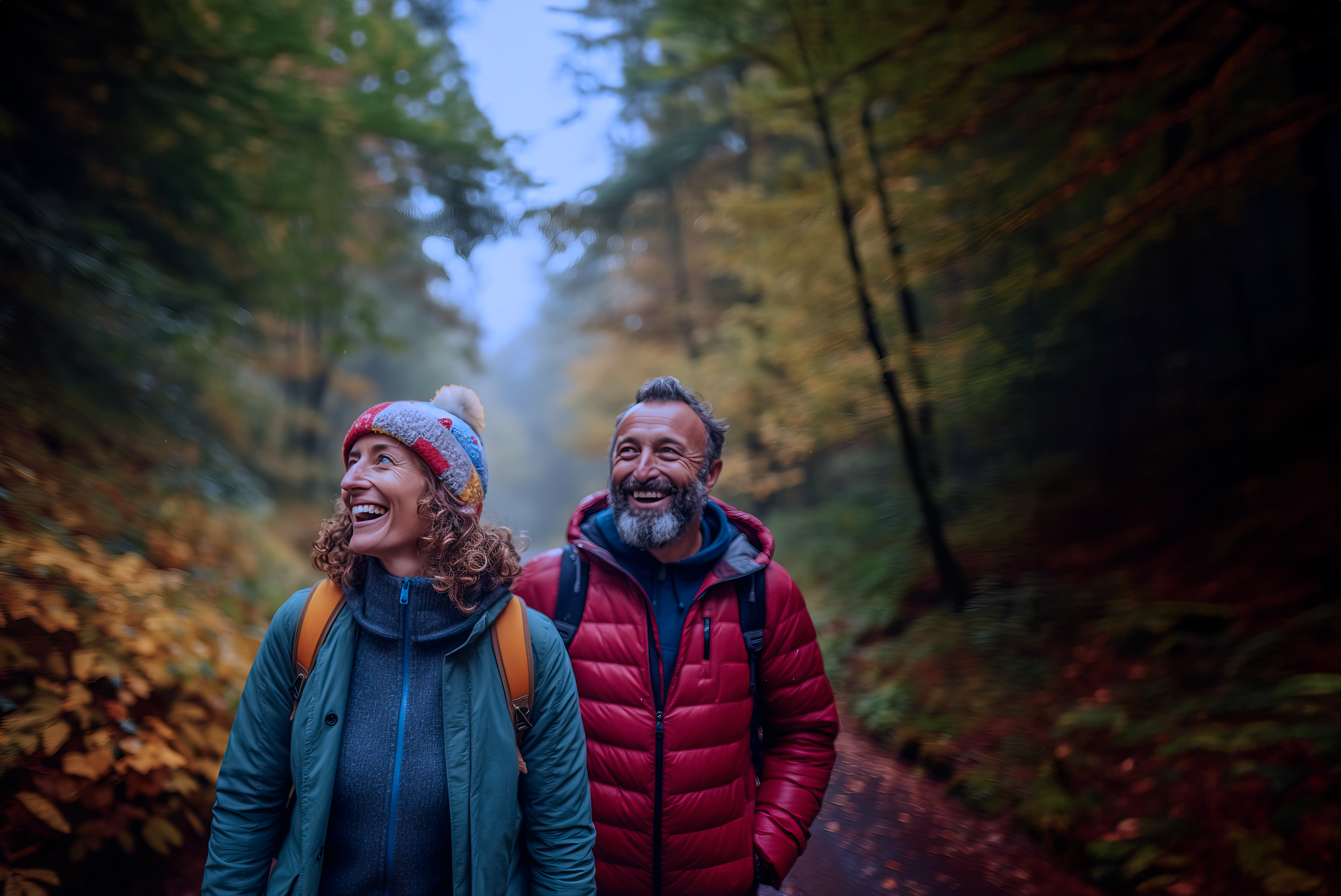 mature couple walking in autumn woods